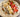 Image d'une crème de riz onctueuse avec des fruits et graines en topping.