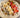 Image d'une crème de riz onctueuse avec des fruits et graines en topping.